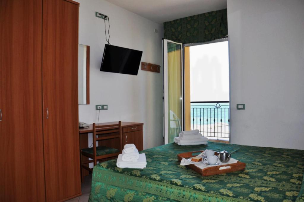 Postel nebo postele na pokoji v ubytování Hotel Belvedere