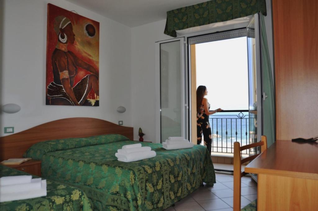 Postel nebo postele na pokoji v ubytování Hotel Belvedere