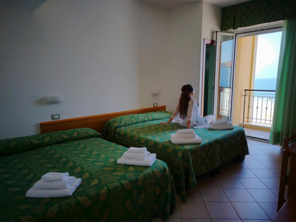 Postel nebo postele na pokoji v ubytování Hotel Belvedere
