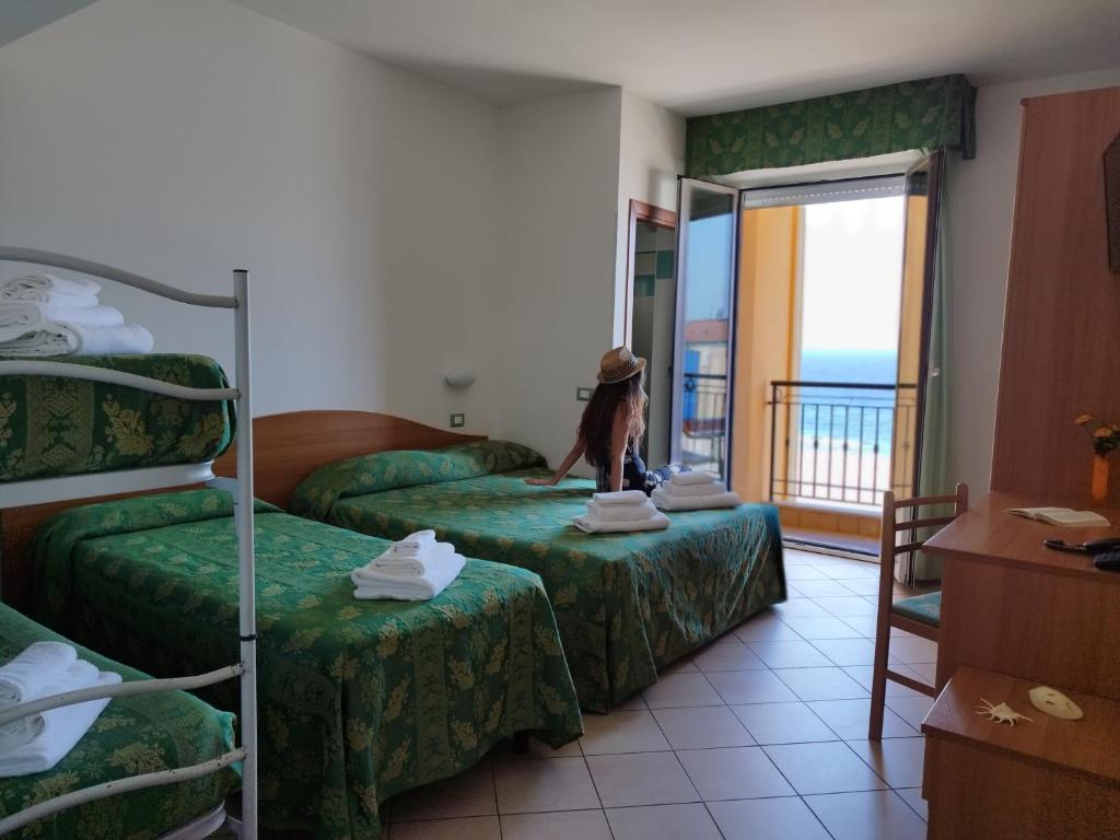 Postel nebo postele na pokoji v ubytování Hotel Belvedere