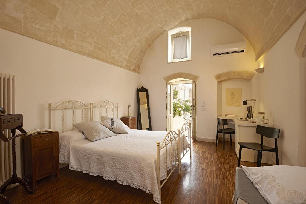 Una cama o camas en una habitación de Fra I Sassi Residence
