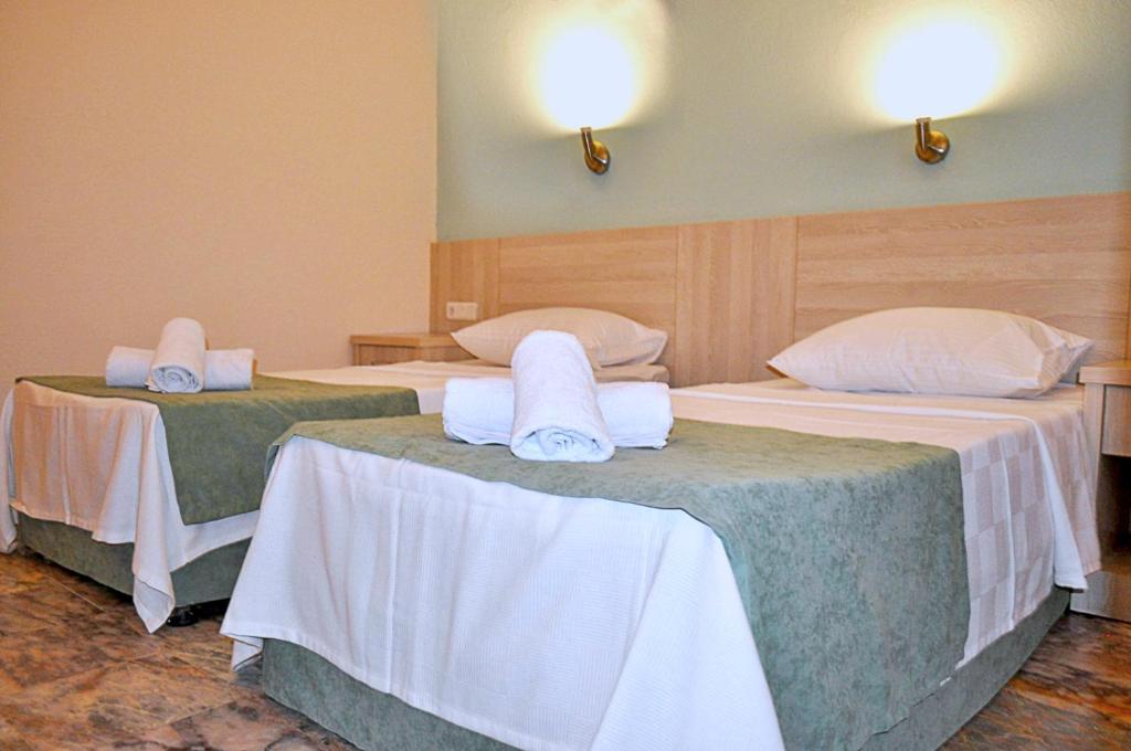 Postel nebo postele na pokoji v ubytování Native Hotel