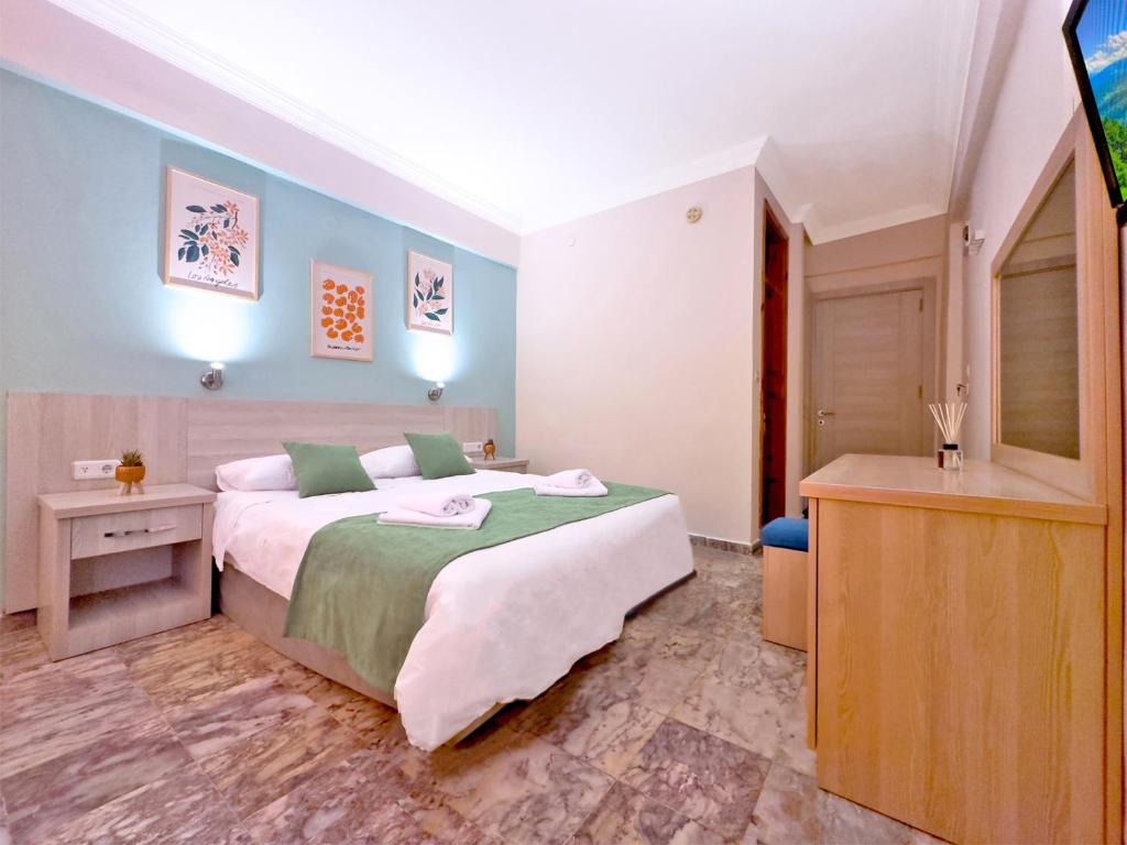 Postel nebo postele na pokoji v ubytování Native Hotel