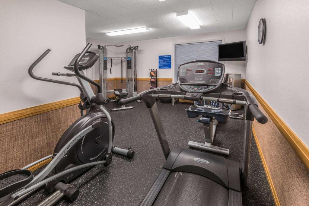 a room with a gym with a treadmill at Days Inn by Wyndham Great Falls in Great Falls