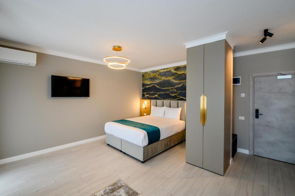 Postel nebo postele na pokoji v ubytování Elitte Inn & Suites