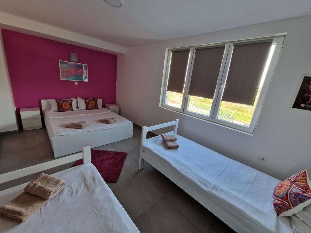 Postel nebo postele na pokoji v ubytování Flamingo Resort