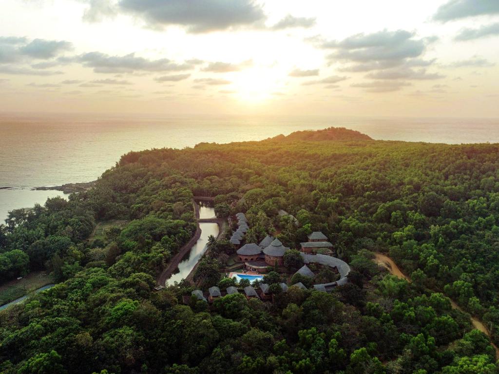 an aerial view of a resort on a hill next to the ocean at SwaSwara Gokarna - CGH Earth in Gokarna