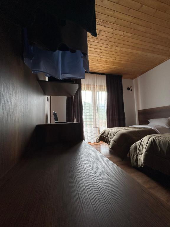 Postel nebo postele na pokoji v ubytování Bujtina Terthorja