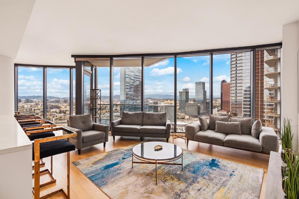 a living room with a view of a city at 3 Bed 3 Bath Penthouse at Prime Location in Los Angeles