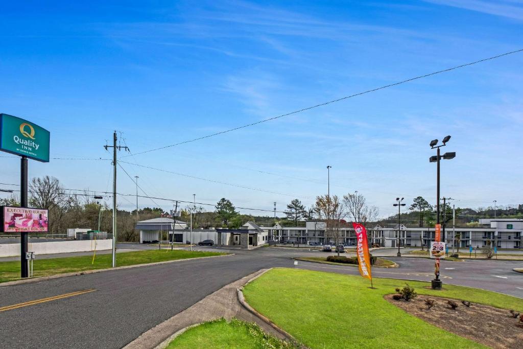 an empty road in front of a gas station at Quality Inn in Dalton