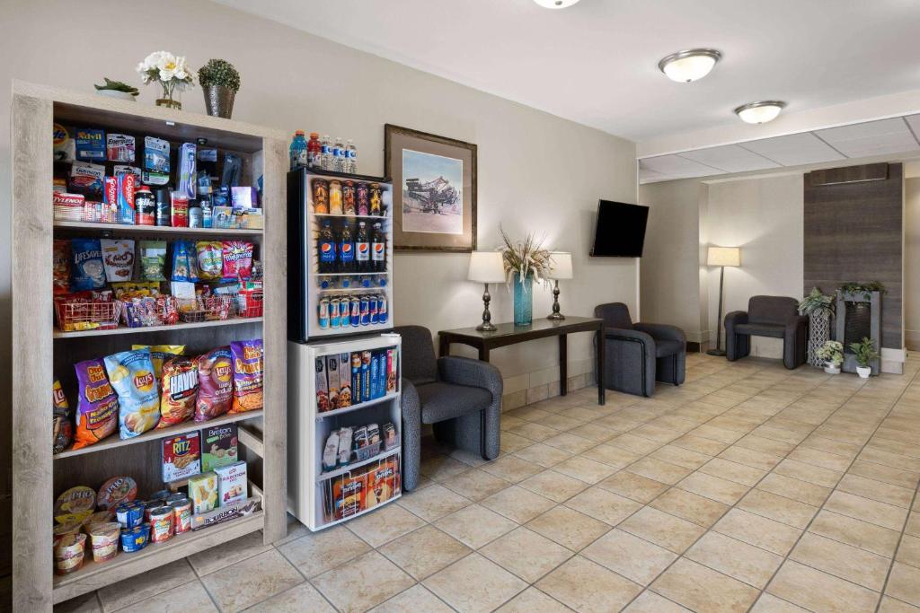 a waiting room at a hospital with food at Travelodge by Wyndham Fort McMurray in Fort McMurray