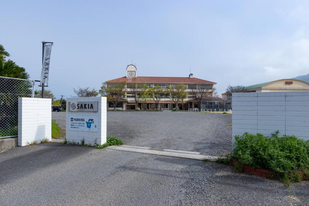 a gate with a sign in front of a building at SAKIA stay in Awaji