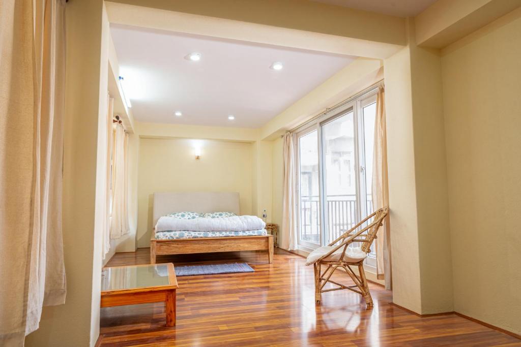 Postel nebo postele na pokoji v ubytování Vajracharya House