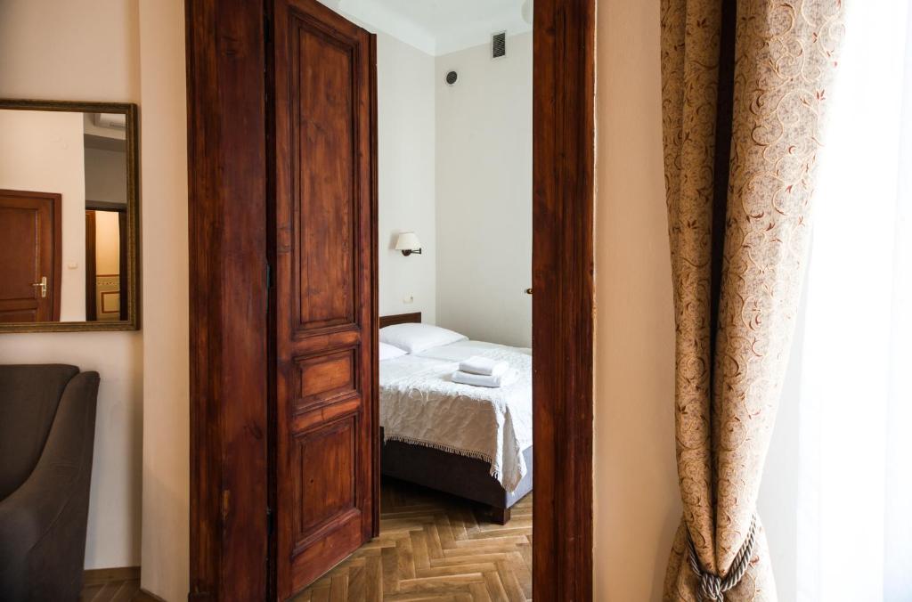 Posteľ alebo postele v izbe v ubytovaní Aparthotel Basztowa
