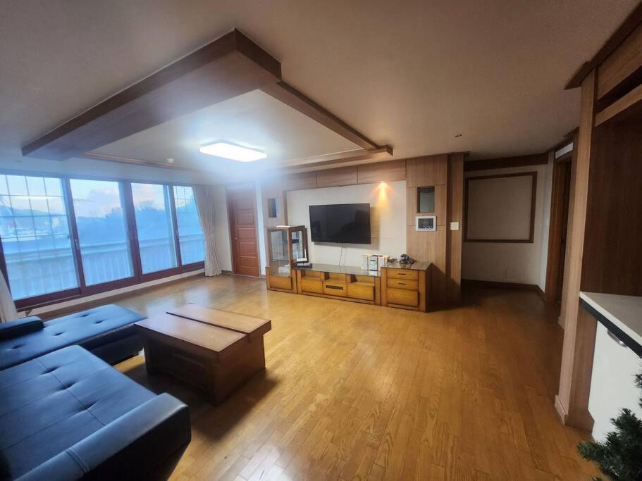 a living room with a couch and a flat screen tv at house for rest in Geoje