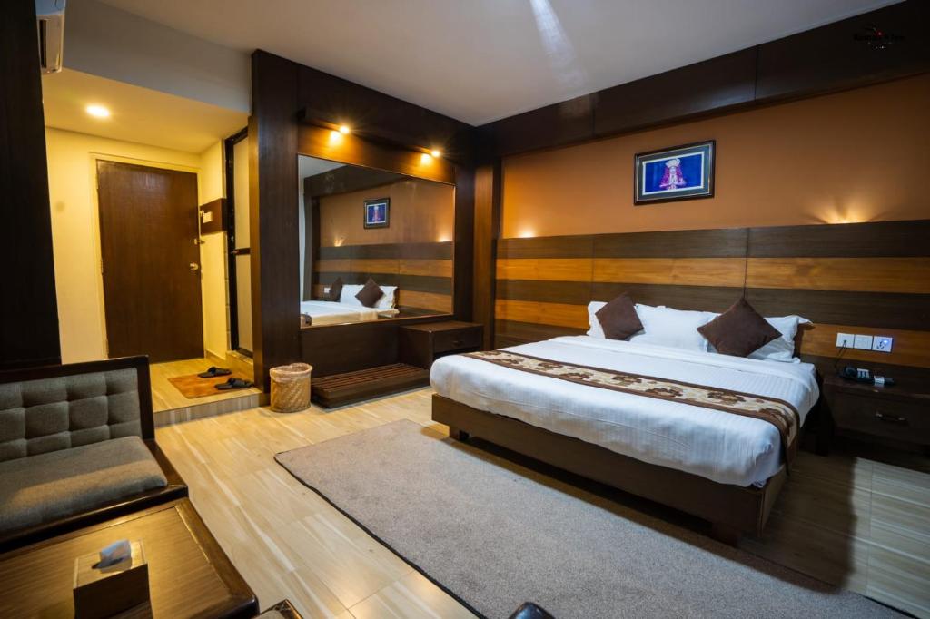 Letto o letti in una camera di Kumari Star Inn