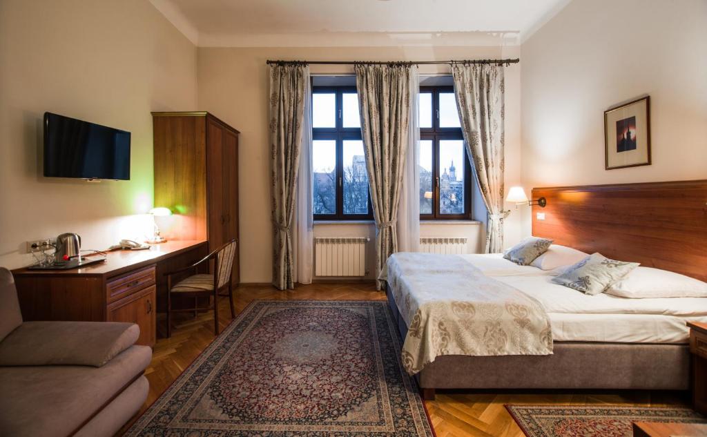 Posteľ alebo postele v izbe v ubytovaní Aparthotel Basztowa