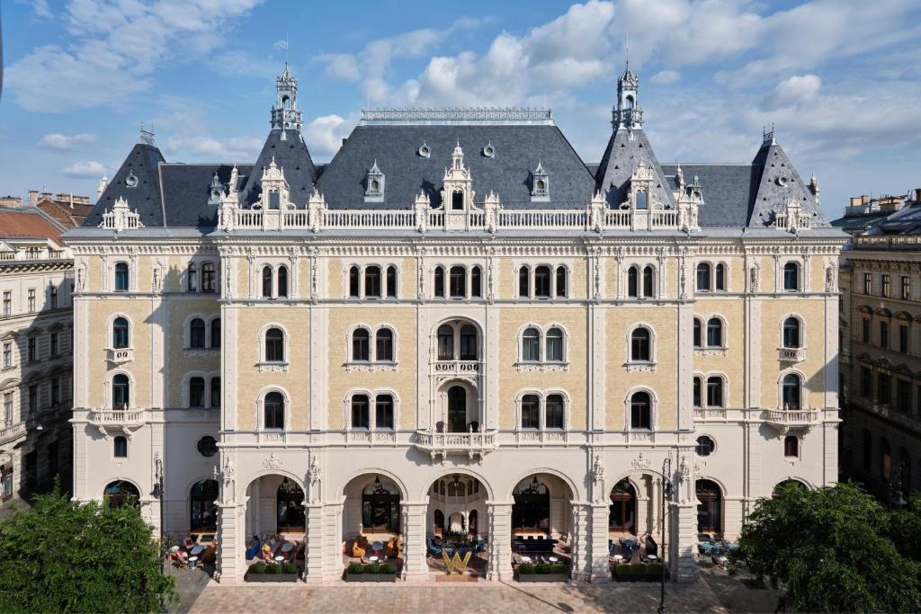 a large white building with a black roof at W Budapest in Budapest