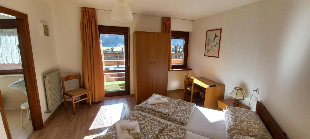 Postel nebo postele na pokoji v ubytování Hotel Salgetti