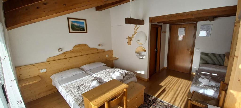 Postel nebo postele na pokoji v ubytování Hotel Salgetti