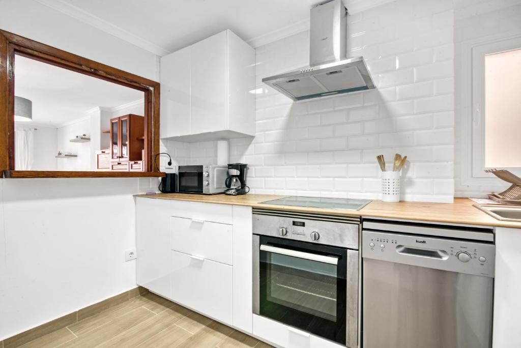 Kuchyň nebo kuchyňský kout v ubytování Apartamento Luisa