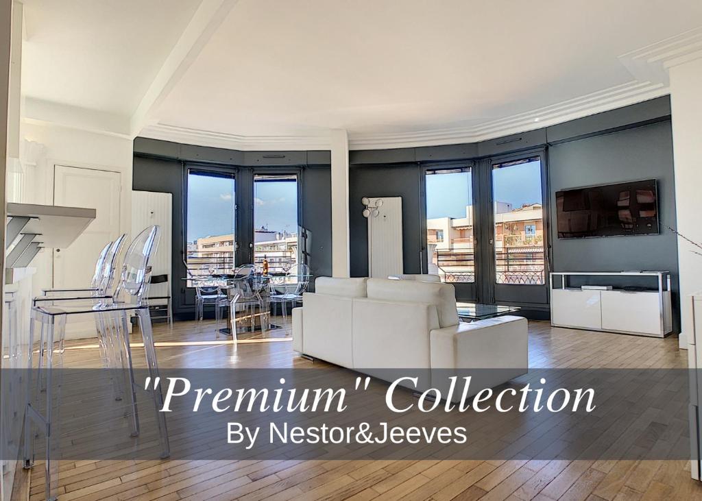 a large living room with white furniture and windows at Nestor&Jeeves - LES AIGLES - Very close sea - Top floor - Luxurious in Nice