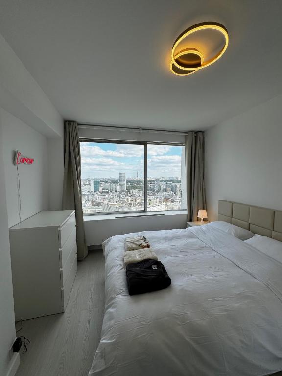 Postel nebo postele na pokoji v ubytování Paris Bleu