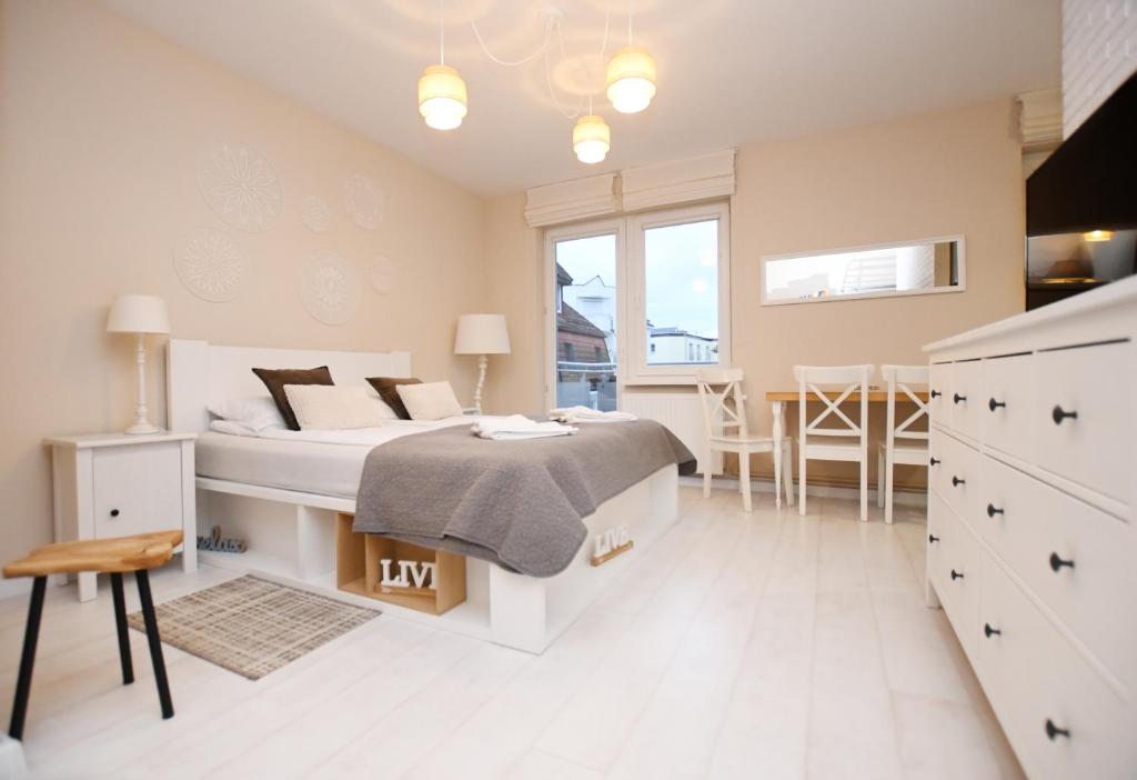 Posteľ alebo postele v izbe v ubytovaní Apartamenty NAVIGATOR-PORT
