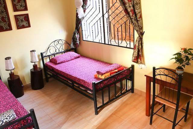 Postel nebo postele na pokoji v ubytování BABA AFRICA HOSTEL