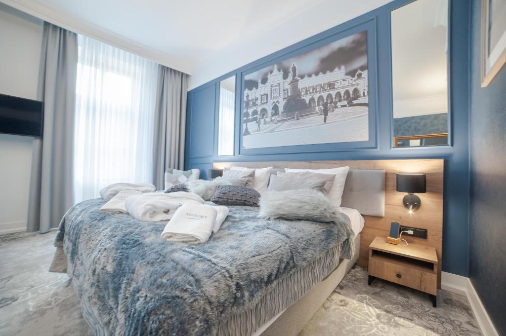 Кровать или кровати в номере Vinfort Aparthotel