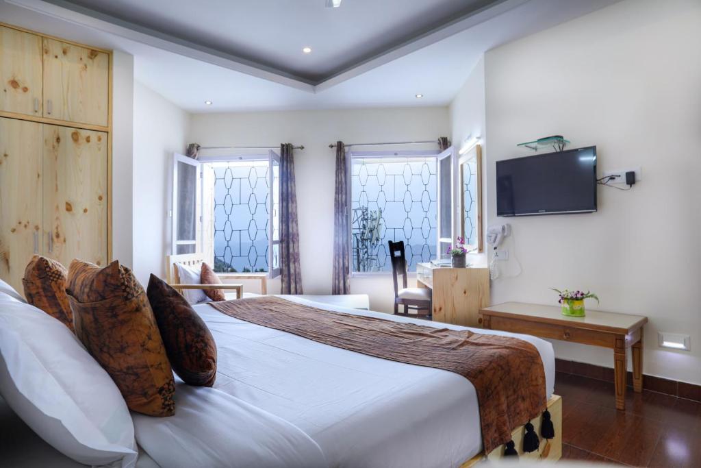Postel nebo postele na pokoji v ubytování Hotel SunGrace