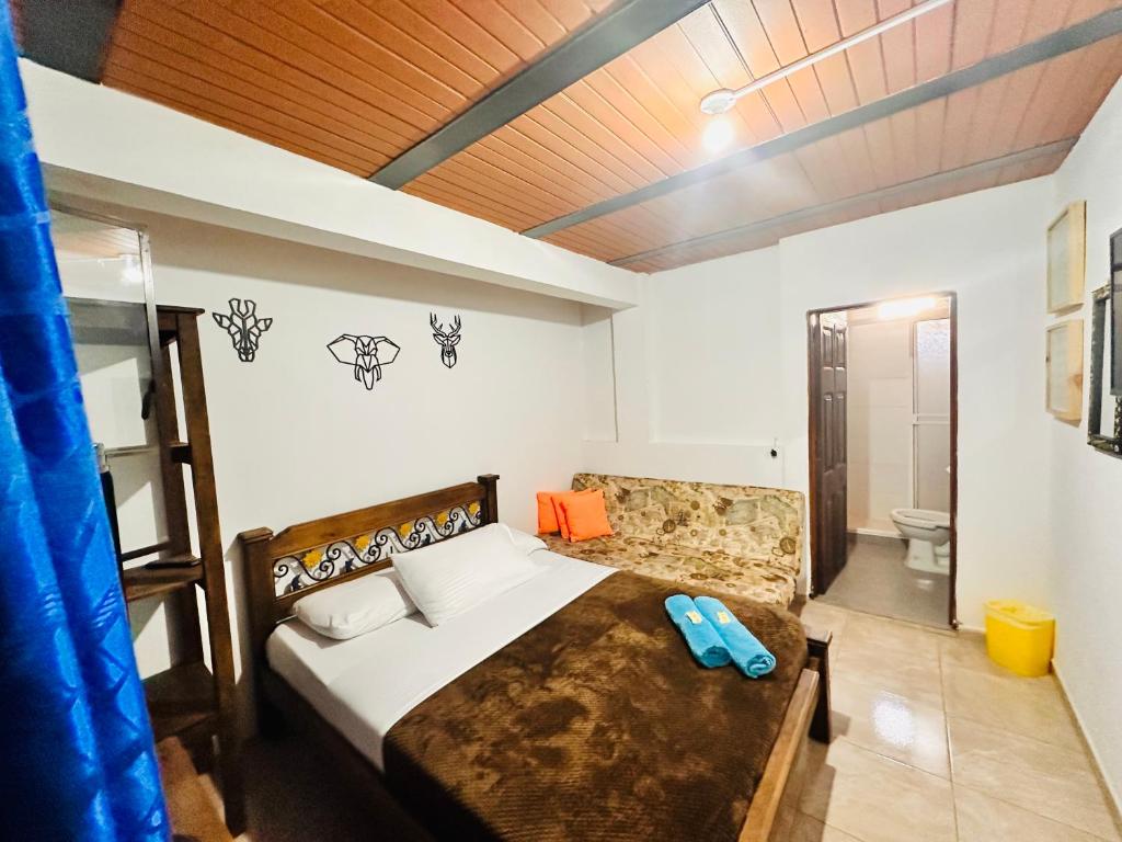 A bed or beds in a room at Casa Hotel Camino Real