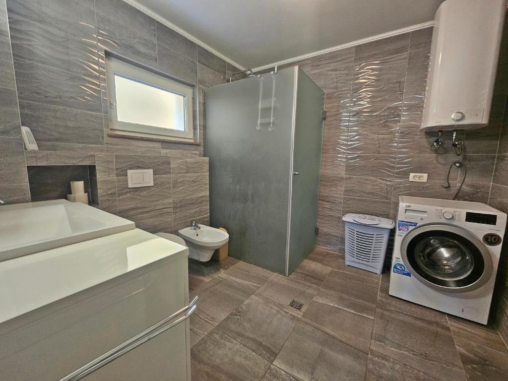 Kúpeľňa v ubytovaní Podstrana Holiday