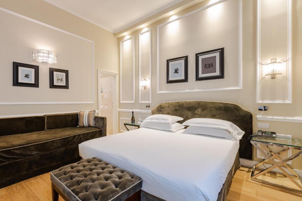 Postel nebo postele na pokoji v ubytování FH55 Hotel Calzaiuoli
