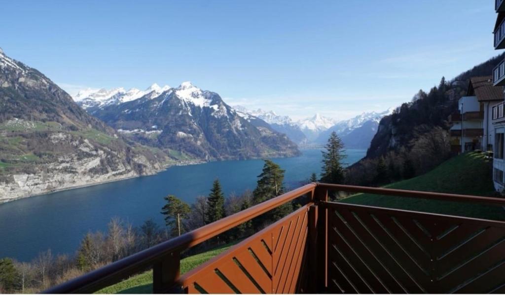 a view of a lake from a balcony at LakeHill72 in Seelisberg