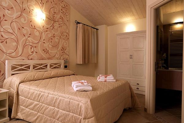 Postel nebo postele na pokoji v ubytování Agriturismo Il Barone