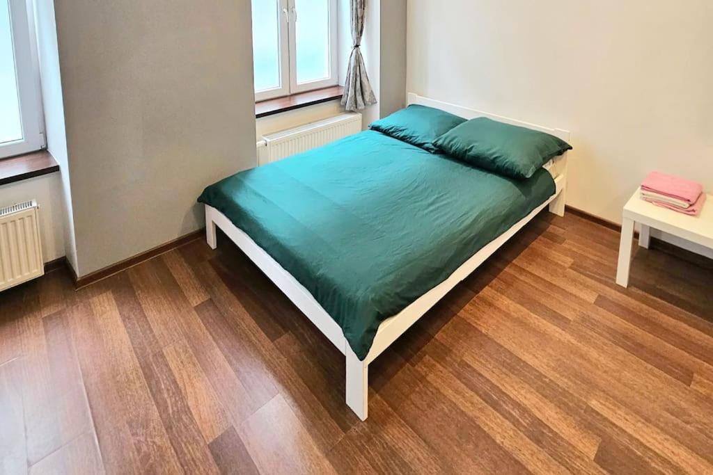 Кровать или кровати в номере PIOTRKOWSKA 132, Apartament 80m2