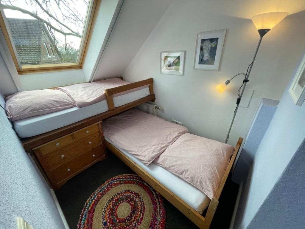 Postel nebo postele na pokoji v ubytování Landhaus up de Warft - Störtebecker