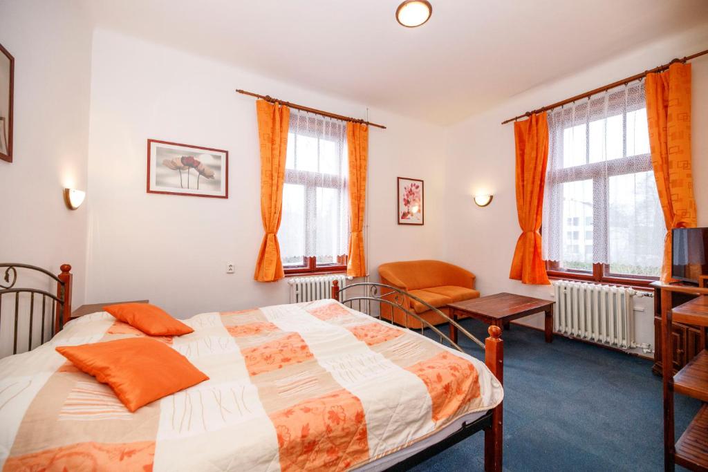 Postel nebo postele na pokoji v ubytování Hotel Grand