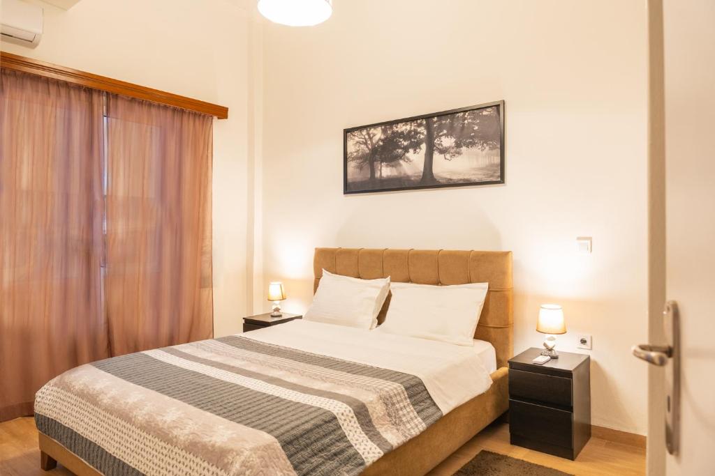 Postel nebo postele na pokoji v ubytování Apartment @Katehaki Metro