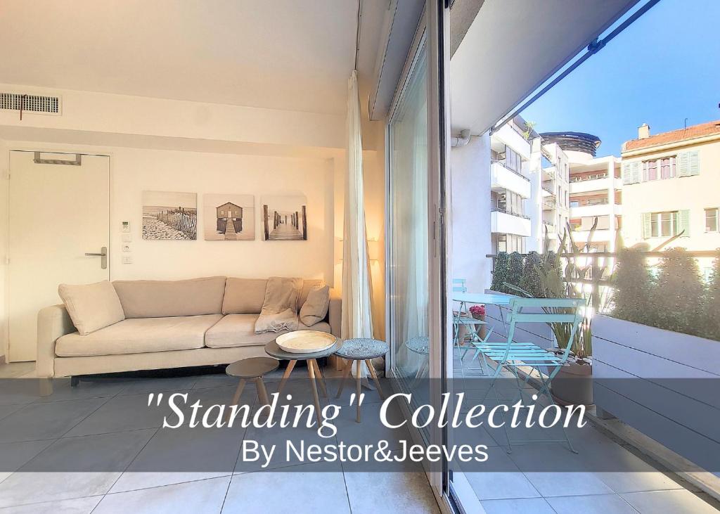 a living room with a couch and a table at Nestor&Jeeves - FRESCO - Central - Very close sea - Balcony in Nice