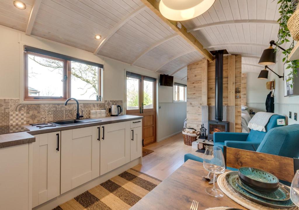 a kitchen and living room in a tiny house at Esk Escape in Longtown
