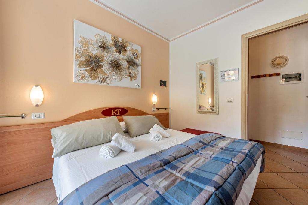 Postel nebo postele na pokoji v ubytování Residence Tatiana A1