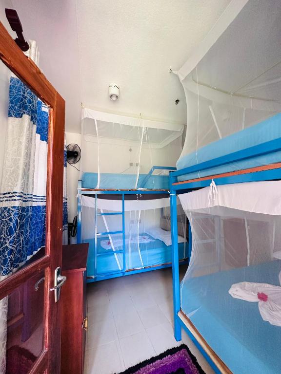 Postel nebo postele na pokoji v ubytování SURF N SPICE - HIRIKETiYA