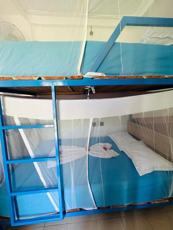 Postel nebo postele na pokoji v ubytování SURF N SPICE - HIRIKETiYA