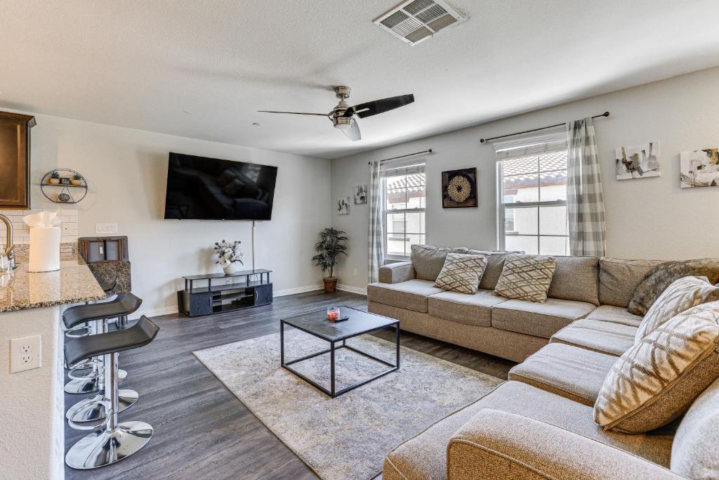 a living room with a couch and a table at Stylish Home with Pool Access, 10 Mi to Vegas Strip! in Las Vegas