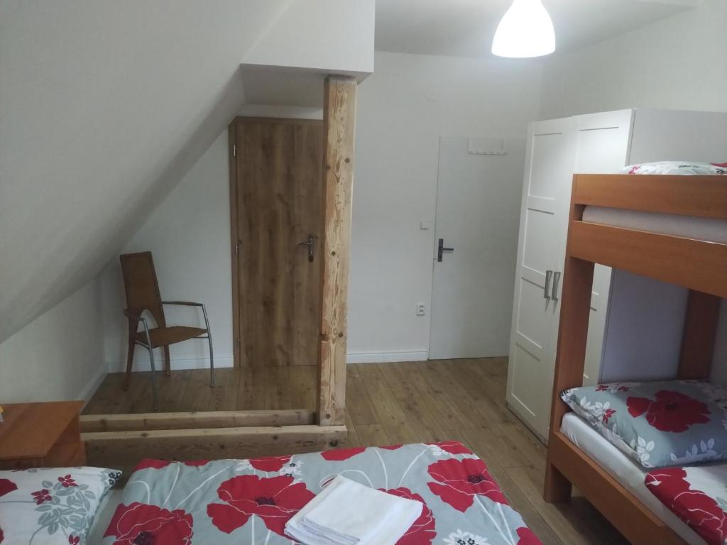 Postel nebo postele na pokoji v ubytování Lipanka