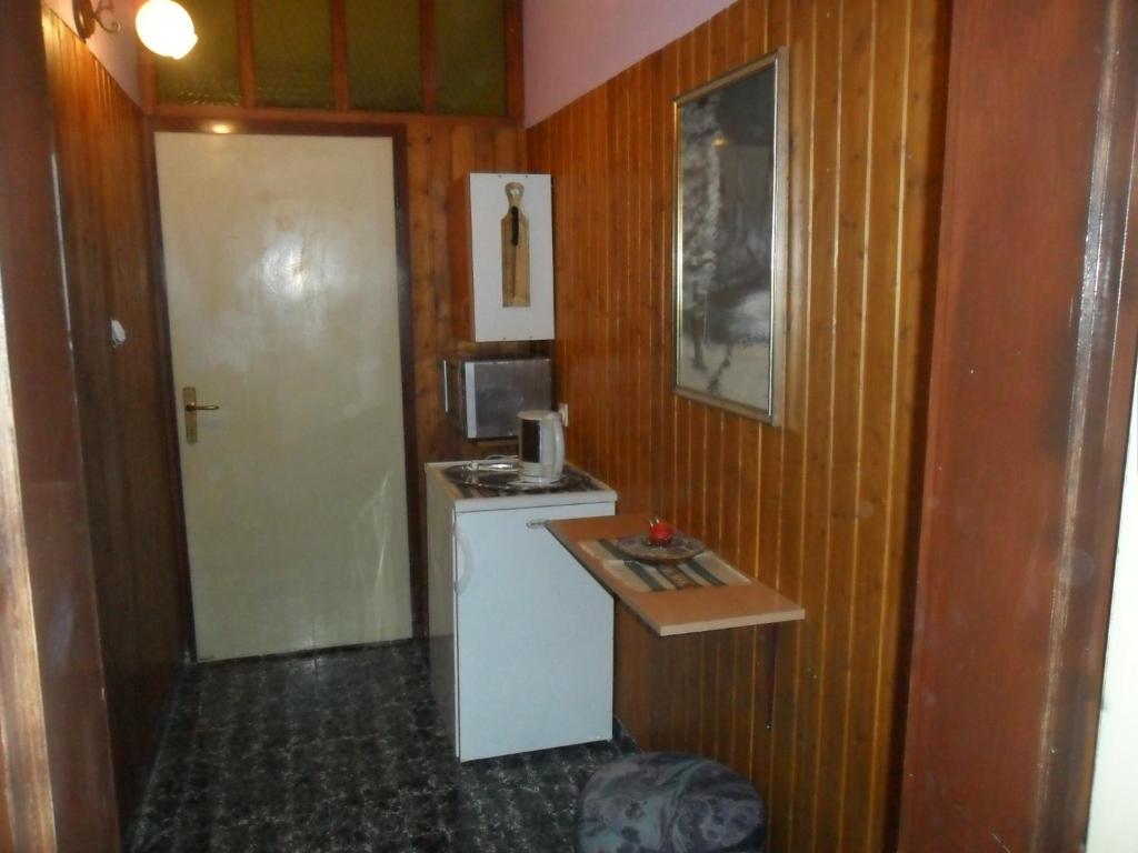 Kuchyň nebo kuchyňský kout v ubytování Apartmani Yucca
