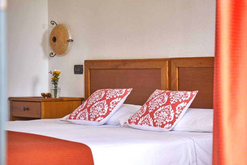 Postel nebo postele na pokoji v ubytování Hotel Fattoria Belvedere