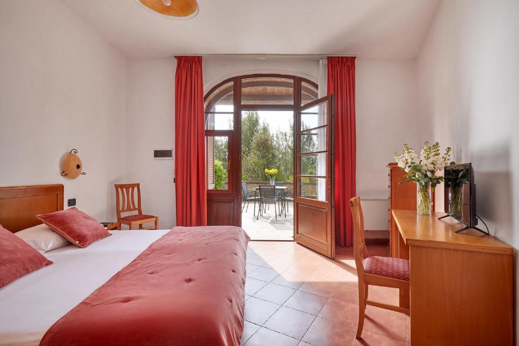 Postel nebo postele na pokoji v ubytování Hotel Fattoria Belvedere